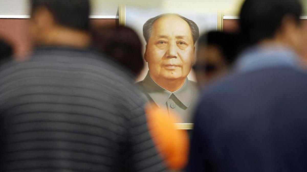 Visitors gather at Tiananmen Gate under the giant portrait of the late Communist Party leader Mao Zedong.