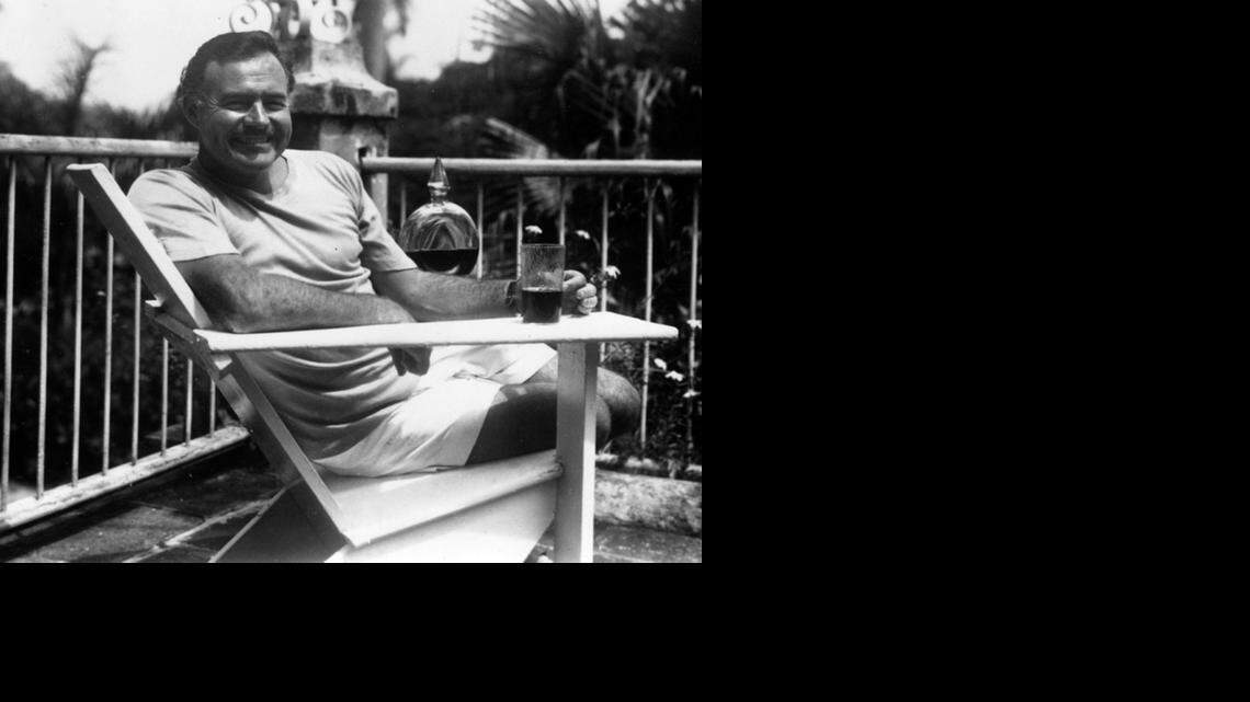 
Ernest Hemingway relaxes at his home in Cuba, Finca Vigia.
