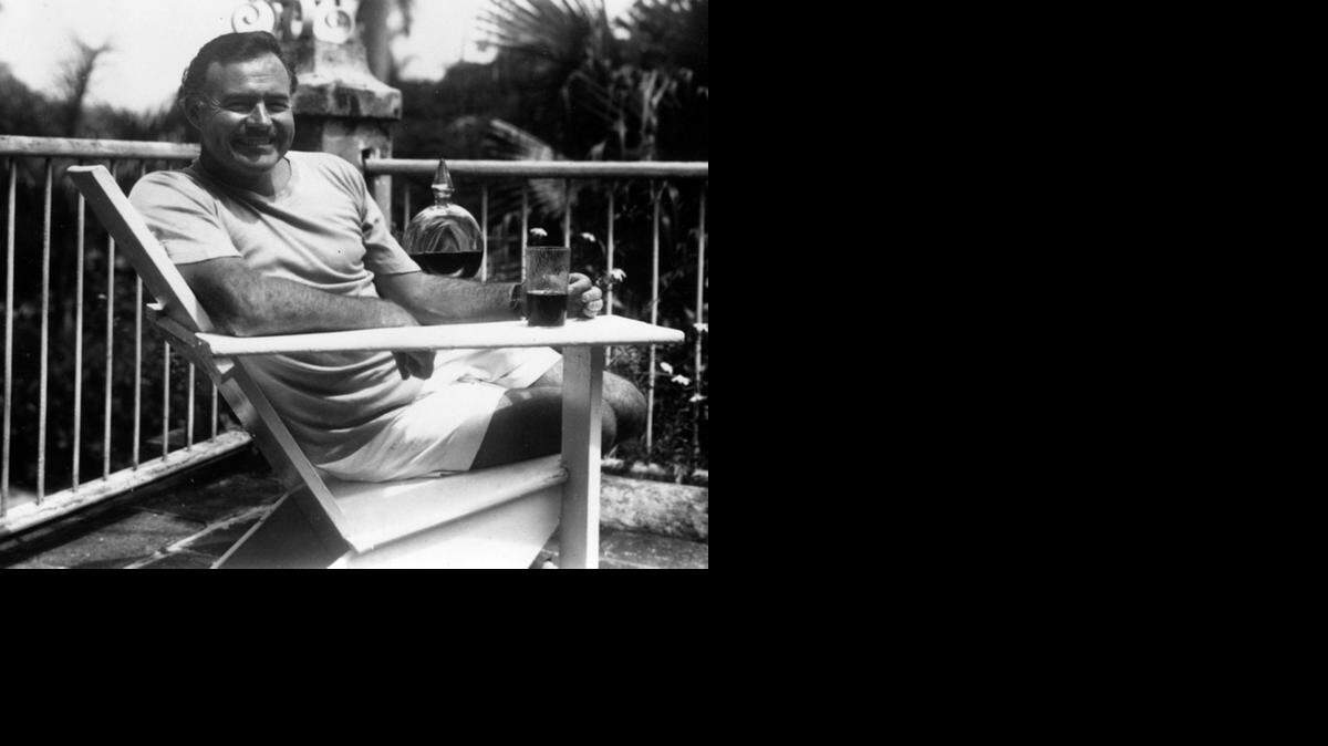 
Ernest Hemingway relaxes at his home in Cuba, Finca Vigia.
