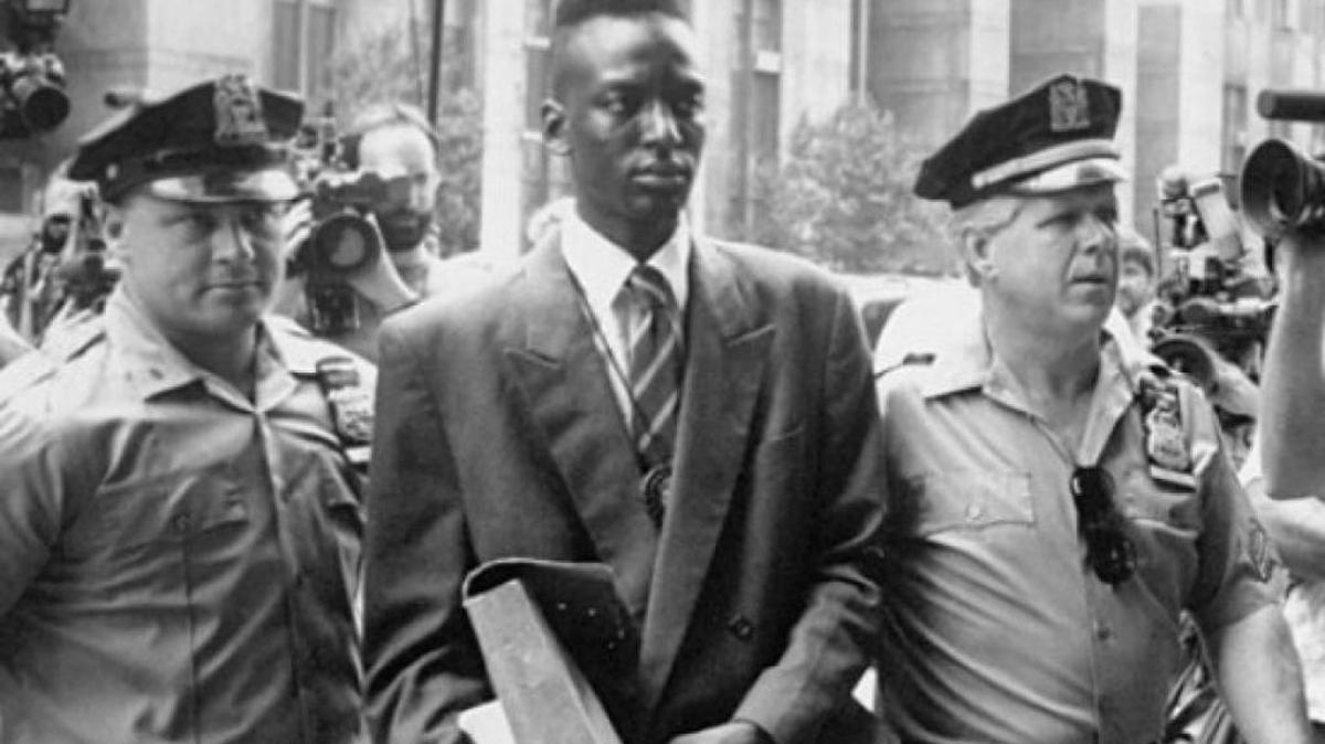 New York police flank Yusef Salaam, accused in 1989, and later exonerated, of participating in a Central Park rape.