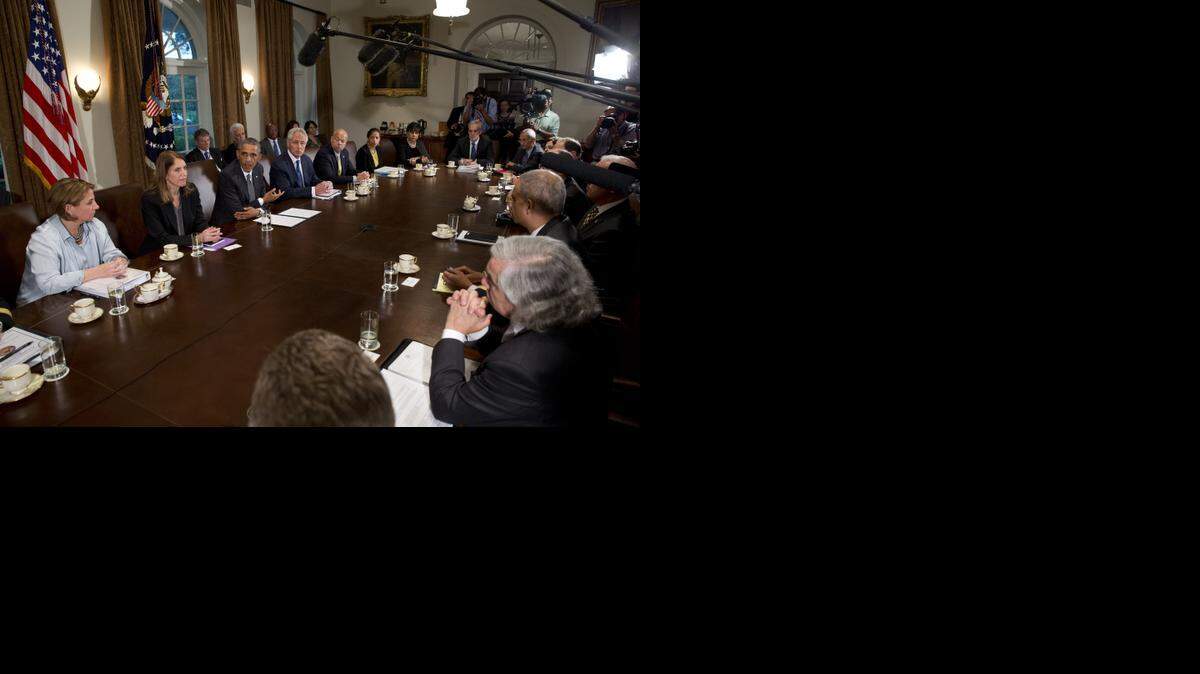 
CRISIS TEAM: President Barack Obama spoke to reporters about Ebola during a meeting in the White House with aides coordinating the response to Ebola. 
