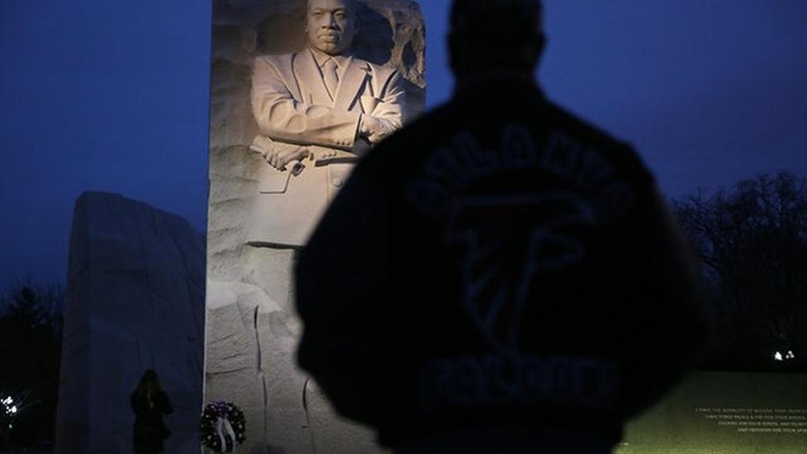 A man stands before the monument of Martin Luther King Jr. in Washington, D.C.