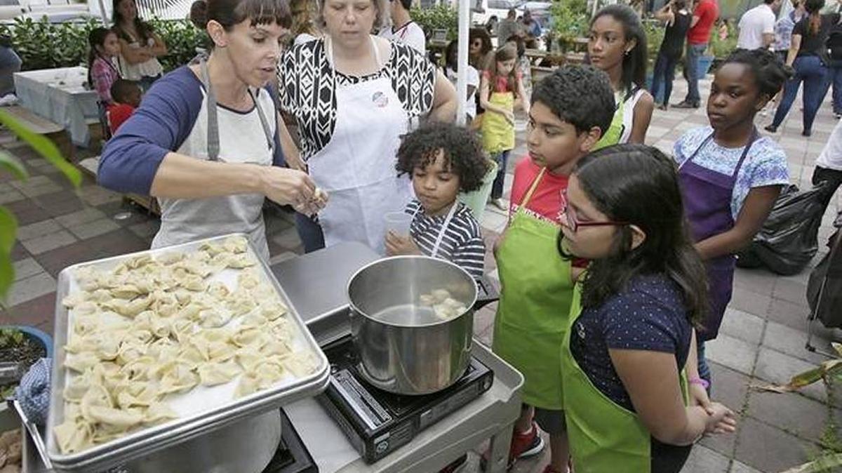 Mimi Chacin, of The Skills Culinary & Kitchen, teaches kids to cook dumplings at The Wynwood Yard in 2016.