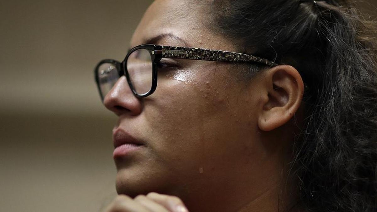 A woman sheds a tear during a Las Vegas protest in response to President Trump’s decision to revoke the DACA program.