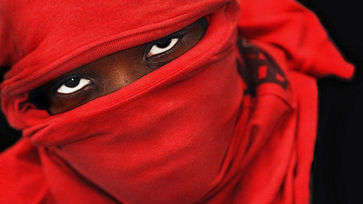 MASK An anonymous Haitian migrant detained at Guantánamo Bay U.S. Naval Base shields his identity in fear of being recognized once he is repatriated back to Haiti. He was one of many detainees protesting for the return of Jean-Bertrand Aristide after he was ousted during a military coup in 1991 and lived in exile for three years in the United States.