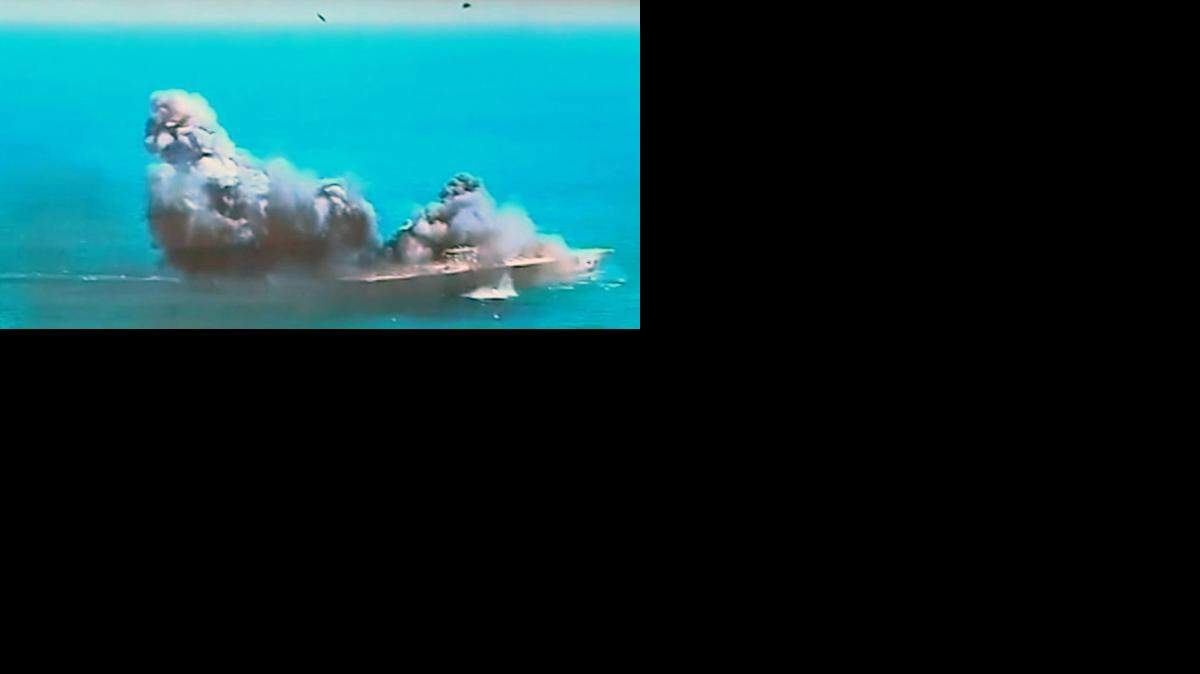 
STRAIT OF HORMUZ: State TV carried video of an Iranian attack on a mock U.S. aircraft carrier during large-scale naval and air defense drills last month.
