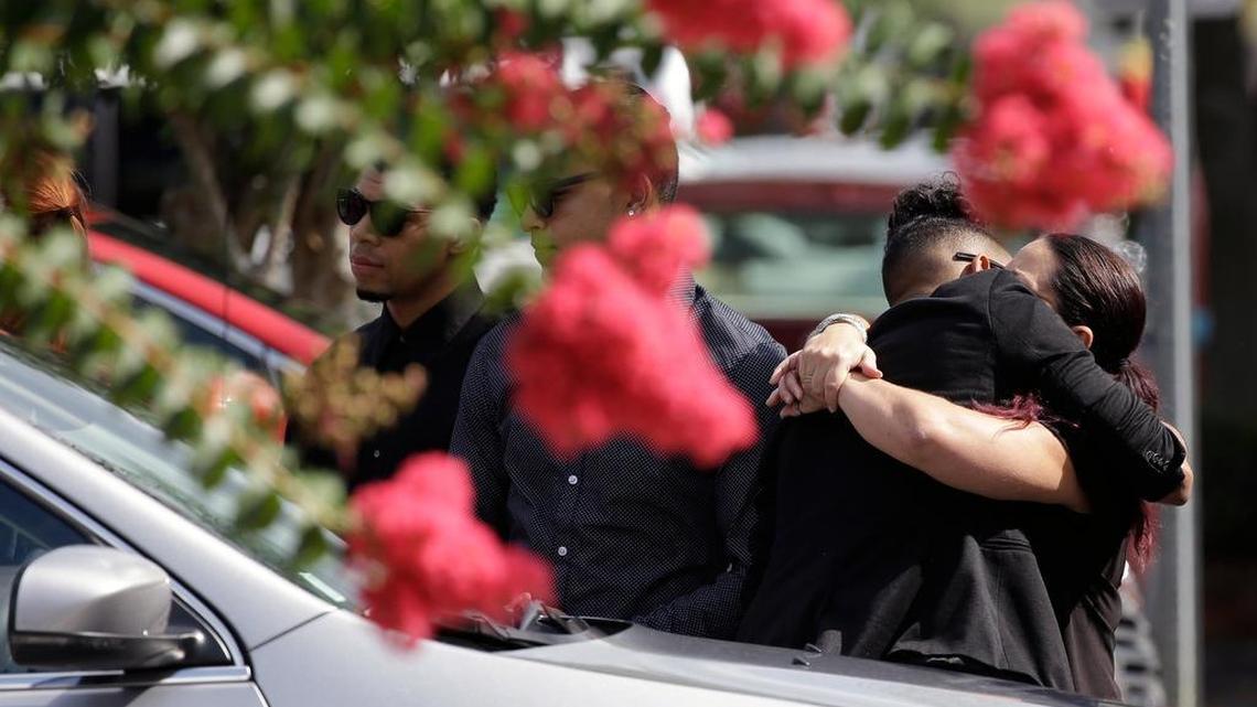 Mourners embrace last week outside the funeral service for Anthony Luis Laureano Disla, one of the victims of the Pulse nightclub mass shooting.