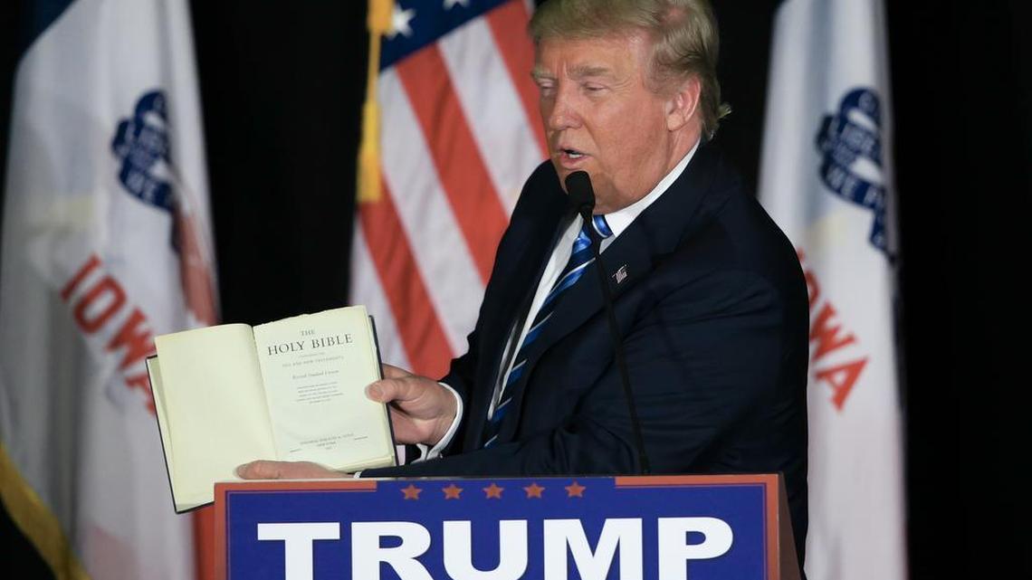 Republican presidential candidate Donald Trump displays his bible during a campaign stop in Council Bluffs, Iowa.