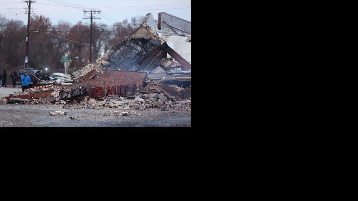 
AFTERMATH: All that was left of a beauty supply store in Ferguson, Missouri, on Tuesday were smoldering remains. 
