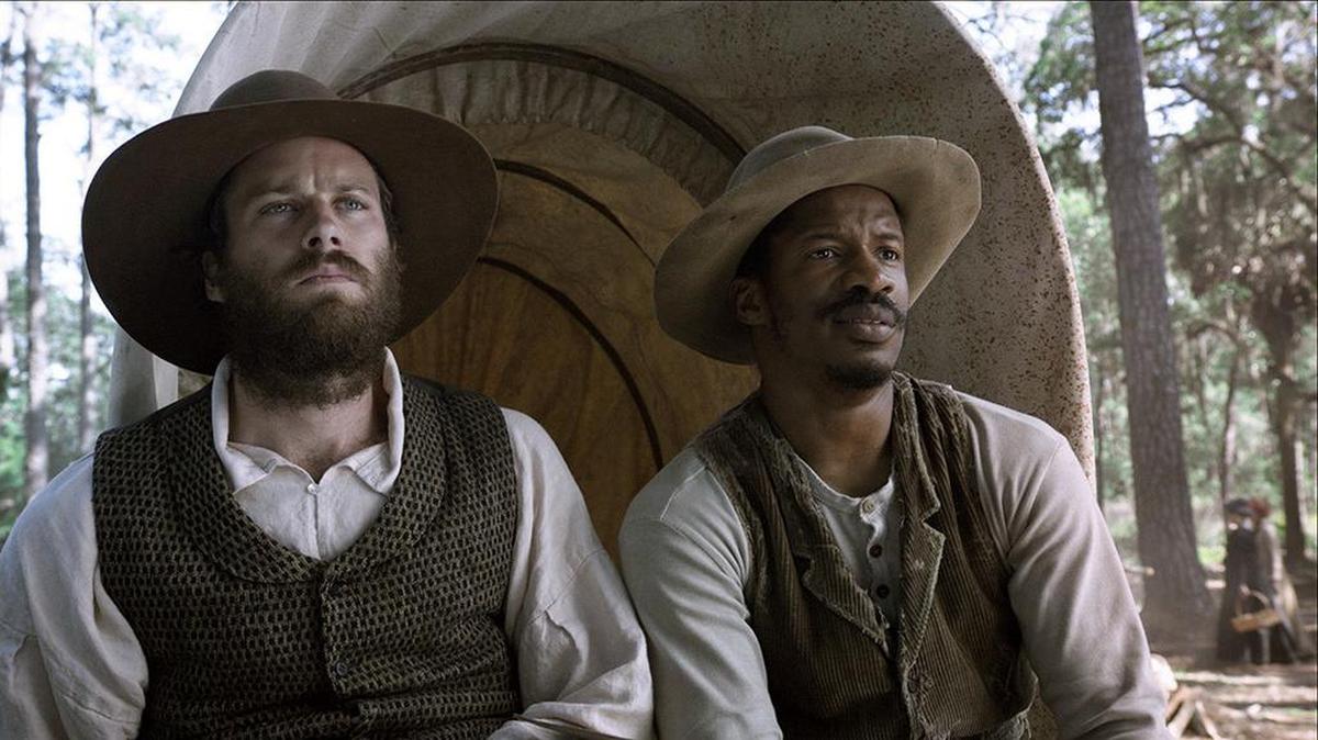 Nate Parker, right, with Armie Hammer in a scene from the upcoming film, “The Birth of a Nation.” Parker directed, co-wrote and co-produced the movie.