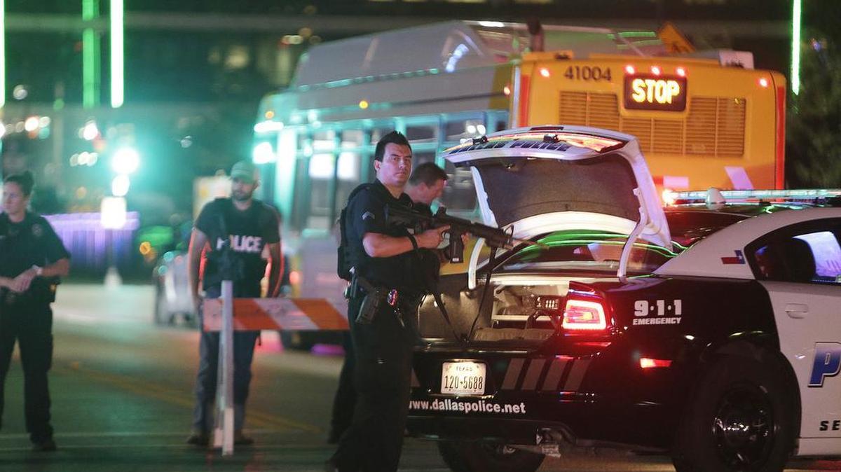 Police block streets in downtown Dallas early as law enforcement investigate the scene of Thursday's fatal shooting, Friday, July 8, 2016. Snipers opened fire on police officers in the heart of Dallas Thursday night, during protests over two recent fatal police shootings of black men.