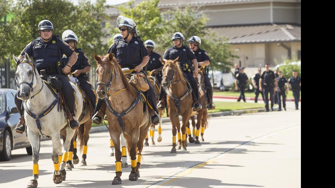 
PREPARED: Sheriff's deputies in Harris County, Tx., get ready for protestors angry over the arrest and subsequent death of Sandra Bland following a traffic stop. Her death in a jail cell was ruled suicide.
