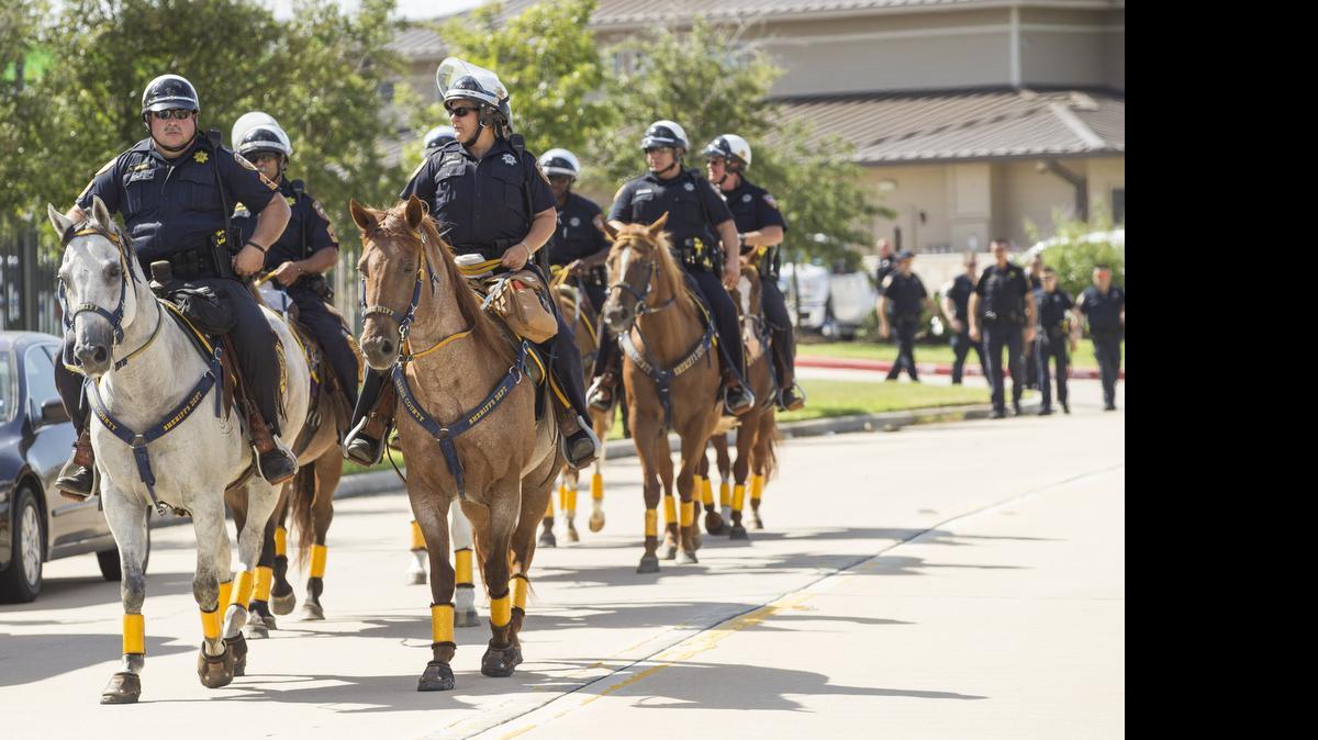 
PREPARED: Sheriff's deputies in Harris County, Tx., get ready for protestors angry over the arrest and subsequent death of Sandra Bland following a traffic stop. Her death in a jail cell was ruled suicide.
