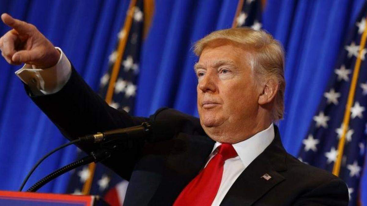 Donald Trump, still president-elect, calls on a reporter during a news conference.