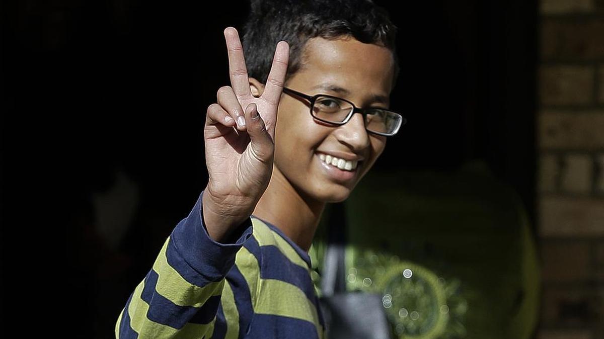 Ahmed Mohamed, 14, gestures as he arrives to his family's home in Irving, Texas, Thursday, Sept. 17, 2015. Ahmed was arrested Monday at his school after a teacher thought a homemade clock he built was a bomb. He remains suspended and said he will not return to classes at MacArthur High School. 
