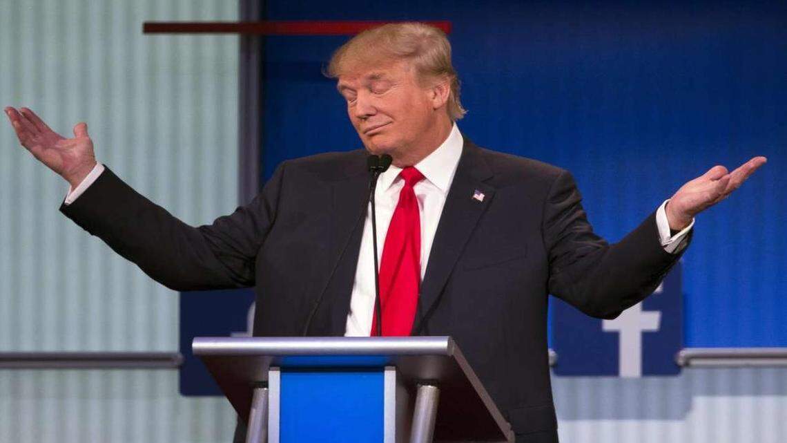 Donald Trump shrugs during the first Republican president debate in Cleveland.