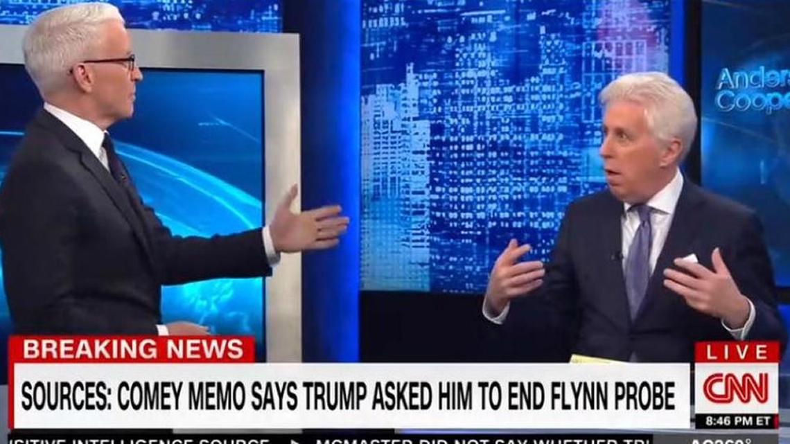 CNN’s Anderson Cooper, left, was clearly frustrated with Jeffrey Lord’s defense of President Trump in light of investigations into the administration’s Russian ties.