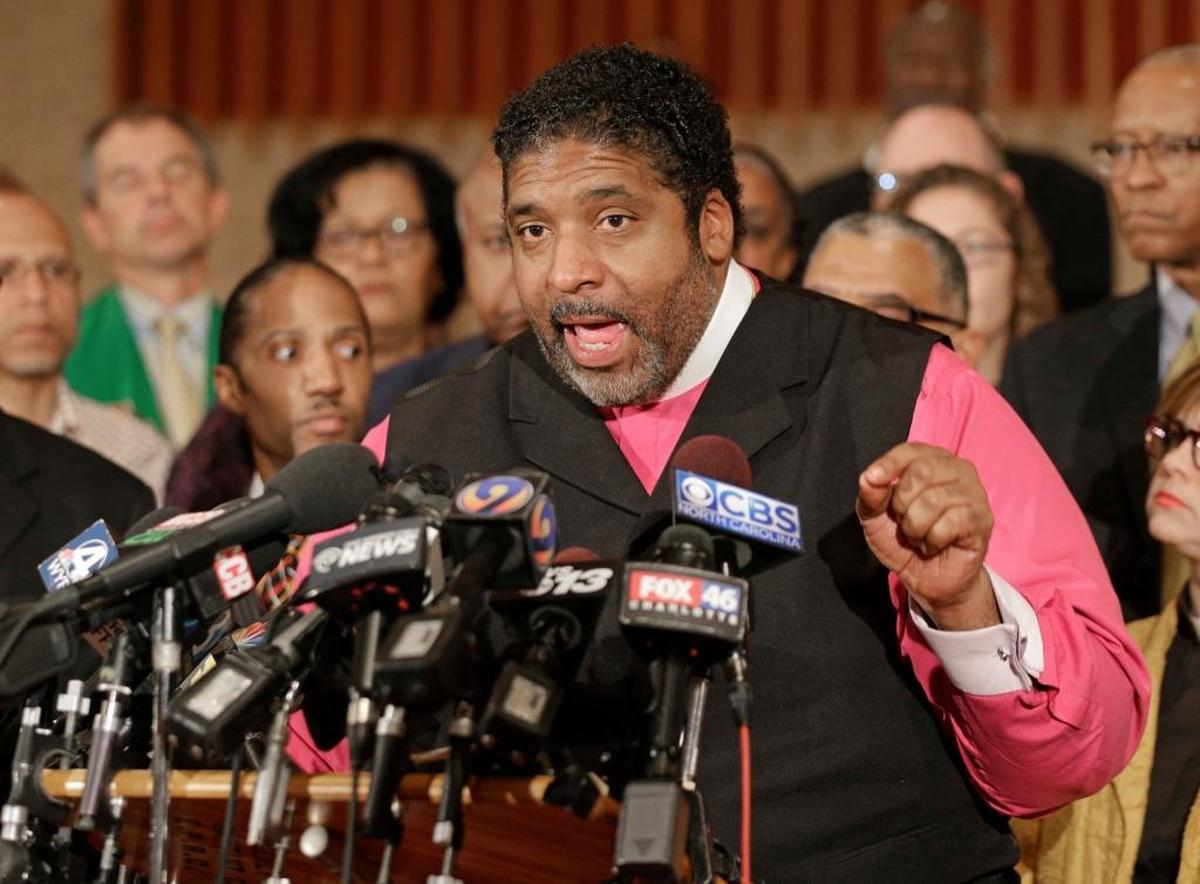 Rev. Dr. William J. Barber II speaks during a news conference after a second night of violence following Tuesday's fatal police shooting of Keith Lamont Scott in Charlotte, N.C. Thursday, Sept. 22, 2016. Charlottte-Mecklenburg Police Chief Kerr Putney has said that Scott refused officers' repeated commands to drop a gun, but he said during a news conference that the video does not definitely show Scott pointing a gun at anyone.