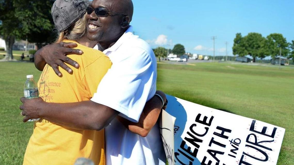 Herman Lindsey, right, hugs a supporter near Florida State Prison. He was the state’s 23rd person exonerated from Death Row.