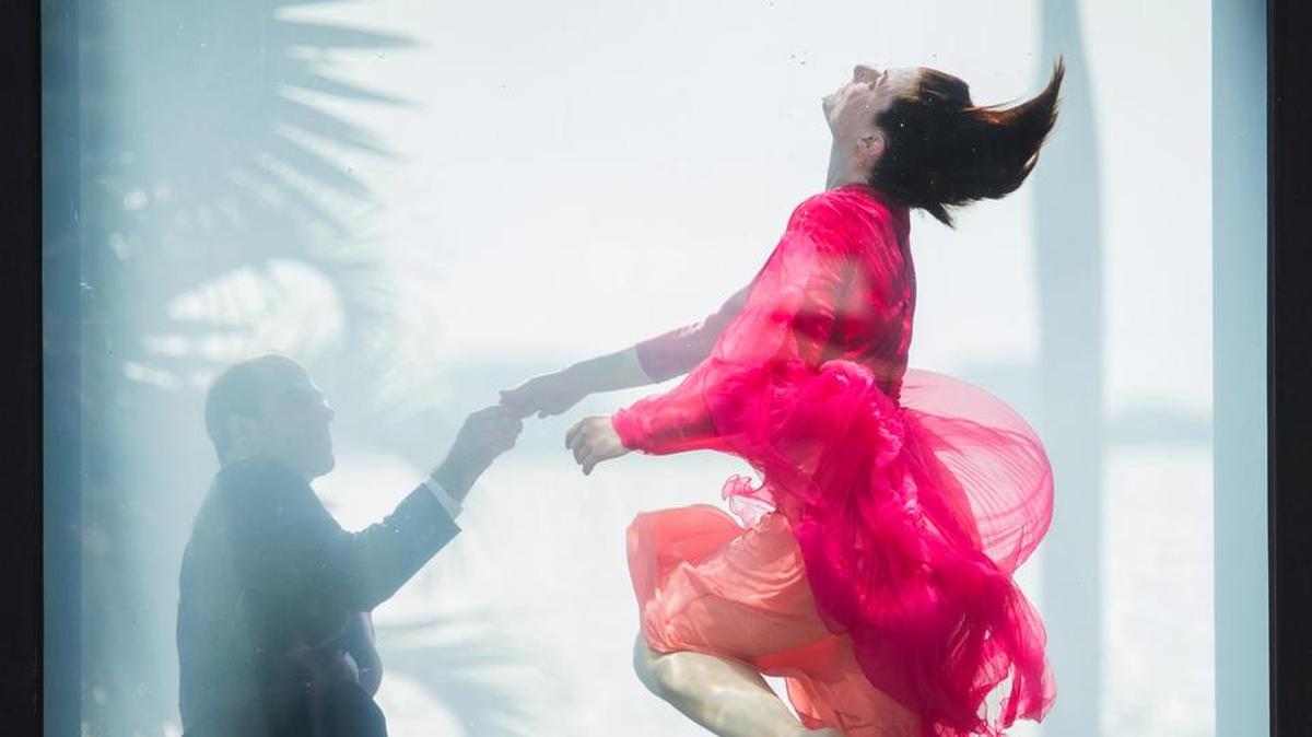Two performers in HOLOSCENES, a public event that addresses climate change.