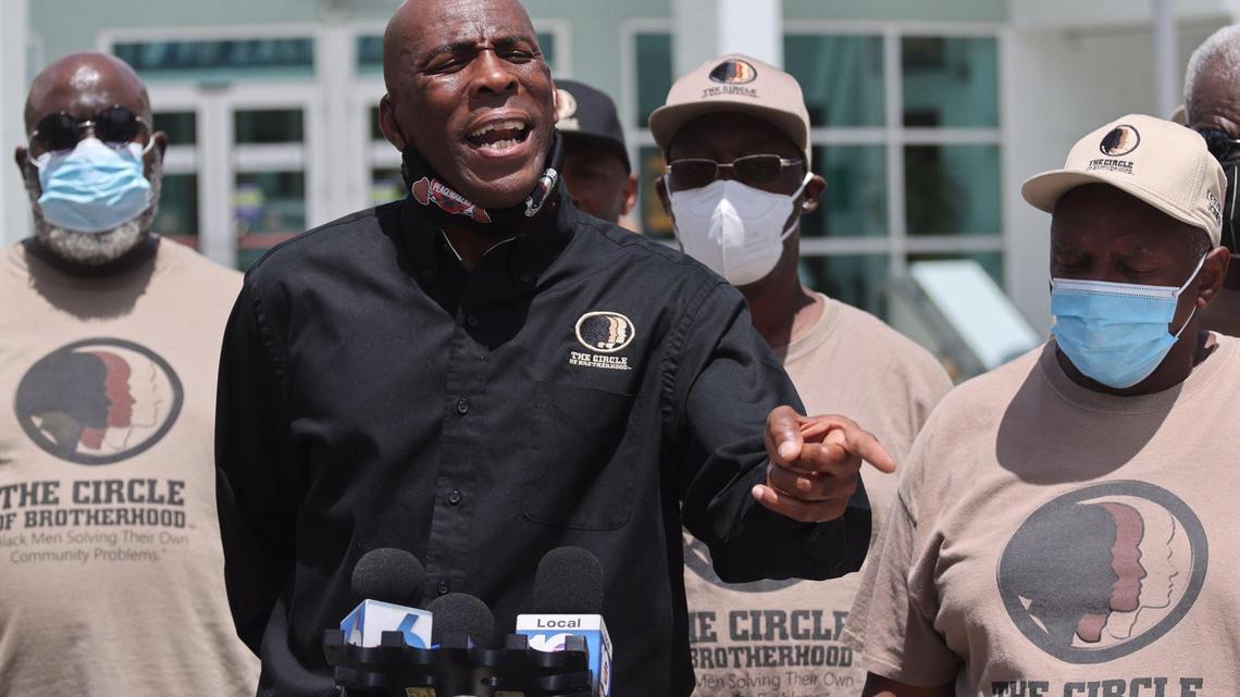 Lyle Muhammad, executive director of the Circle of Brotherhood, holds a press conference outside of Miami Beach Police Department headquarters.