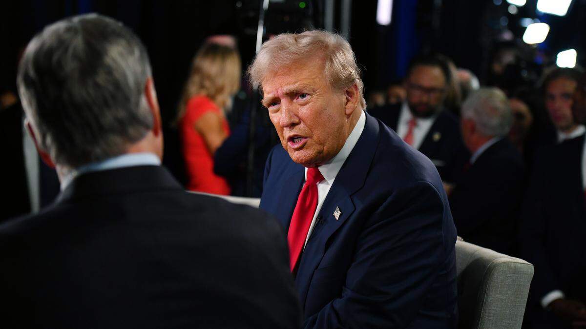 (240914) -- BEIJING, Sept. 14, 2024 (Xinhua) -- Former U.S. President Donald Trump (C) is interviewed at the U.S. presidential debate spin room after the first presidential debate with U.S. Vice President Kamala Harris in Philadelphia, the United States, on Sept. 10, 2024. 