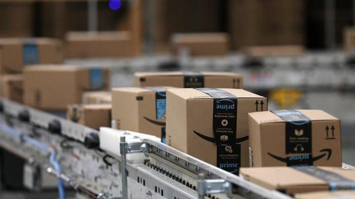 Packages passed down a conveyor belt before receiving a shipping label at Amazon in Shakopee, Minn. Last summer, Amazon broke ground on its 855,000-square-foot fulfillment center in Opa-locka, bringing its industrial footprint in Miami-Dade county alone to close to 1.5 million square feet of space, across multiple buildings in multiple submarkets and neighborhoods.