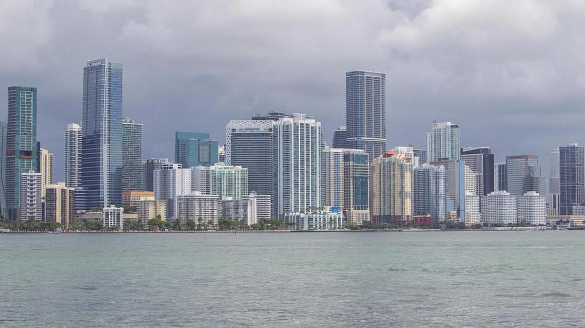 Dark clouds approach downtown Miami as seen from Hobie Island Beach Park in Miami. Farid Moussallem, the director of international sales at Compass and a Master Brokers Forum board member, says he has seen a number of New York- and California-based clients who are looking at Miami properties and who also say they’re interested in escaping the heavy taxes in their current home states. But that doesn’t mean they will claim Florida residency: “While their interest is strong and serious, these particular buyers are in no rush to move here just to avoid the taxman.”