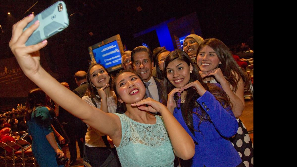 Silver Knight nominee Heejoon Rnoh of Miami Lakes Educational Center takes a selfie with Miami-Dade Schools superintendent Alberto Carvalho prior to the 2015 Silver Knight Awards on May 20, 2015 at the James L. Knight Center in Downtown Miami.