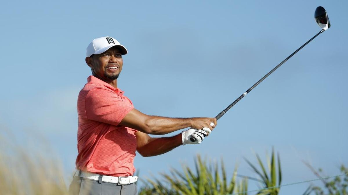 Tiger Woods watches his tee shot on the fourth hole during the Pro-Am at the Hero World Challenge golf tournament, Wednesday, Nov. 30, 2016, in Nassau, Bahamas.