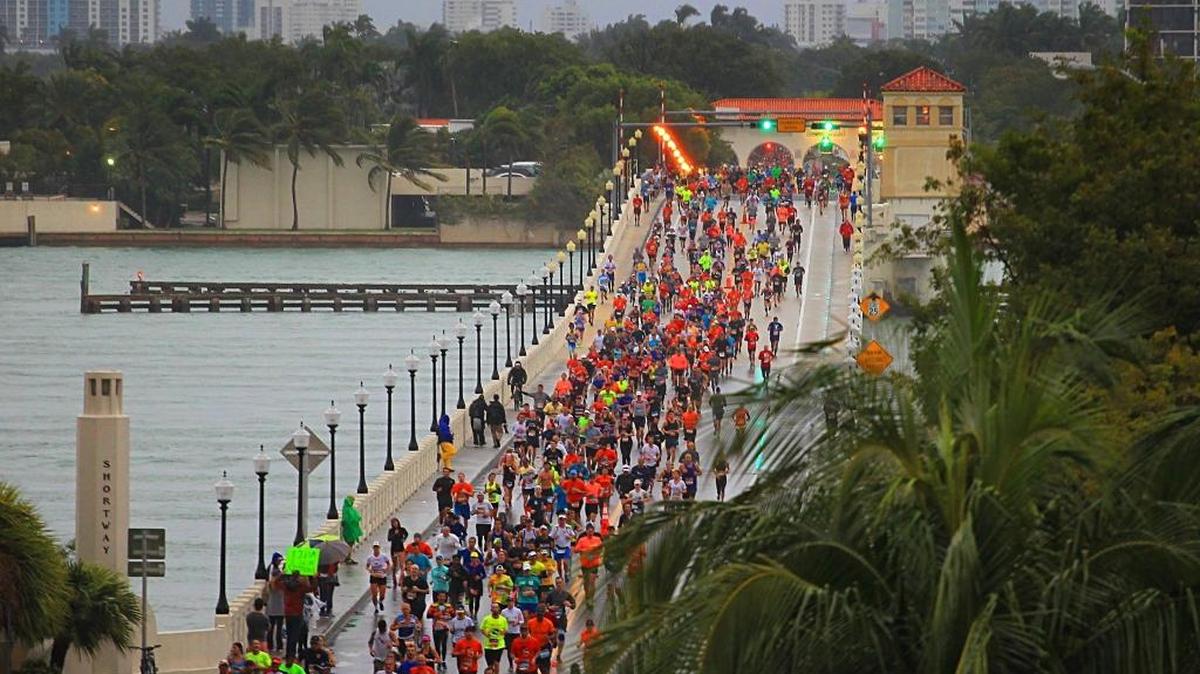 On Sunday, January 29, 2017 thousands of runners make their way on the Venetian Causeway under cold and wet conditions during the Miami Marathon.