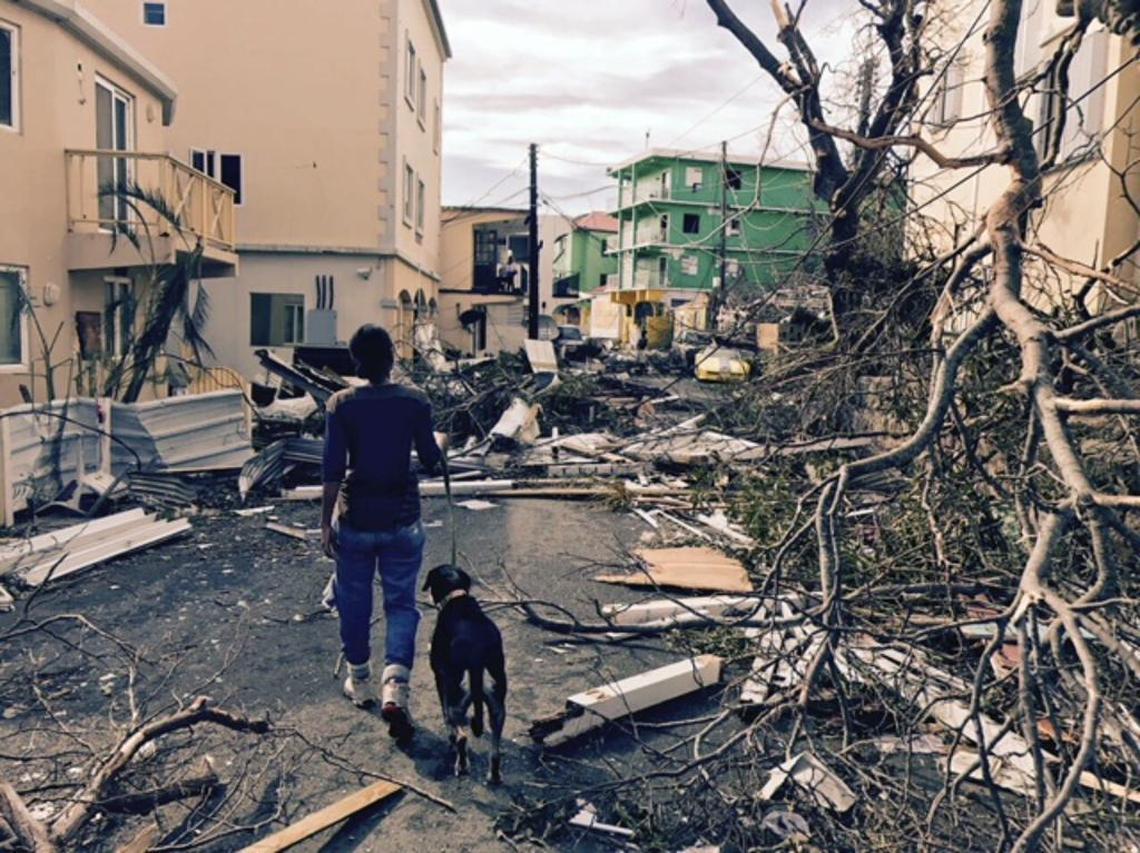 Tameka Davis, a lawyer and marathon runner who lives in Tortola in the British Virgin Islands, walks her dog the day after Hurricane Irma devastated the Caribbean island. She plans to run the full Miami marathon on Sunday, Jan. 28, 2018.