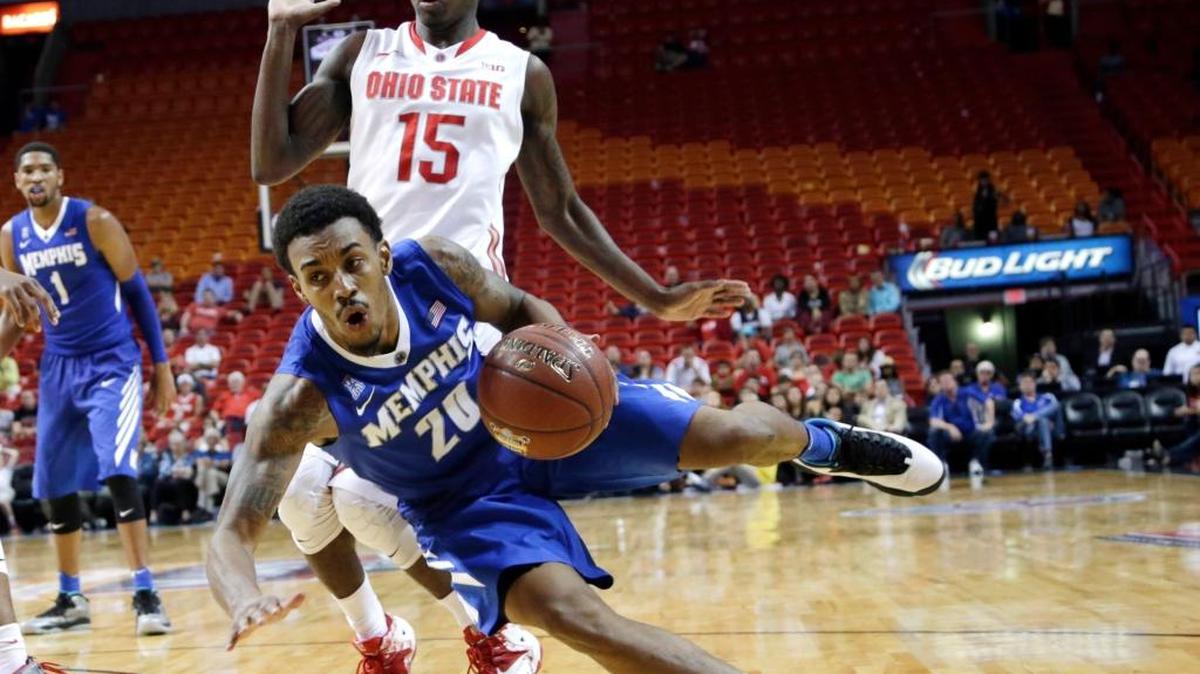 Memphis guard Ricky Tarrant Jr. (20) is fouled by Ohio State guard Kam Williams (15) in overtime of the Hoophall Miami Invitational on Friday, Nov. 27, 2015, in Miami. Memphis defeated Ohio State 81-76 in overtime.