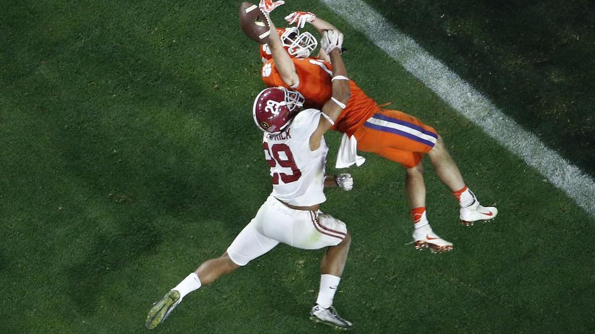 Alabama's Minkah Fitzpatrick, left, breaks up a pass intended for Clemson's Hunter Renfrow during the second half of the NCAA college football playoff championship game Monday, Jan. 11, 2016, in Glendale, Ariz. The Dolphins drafted Fitzpatrick 11th overall on Thursday.