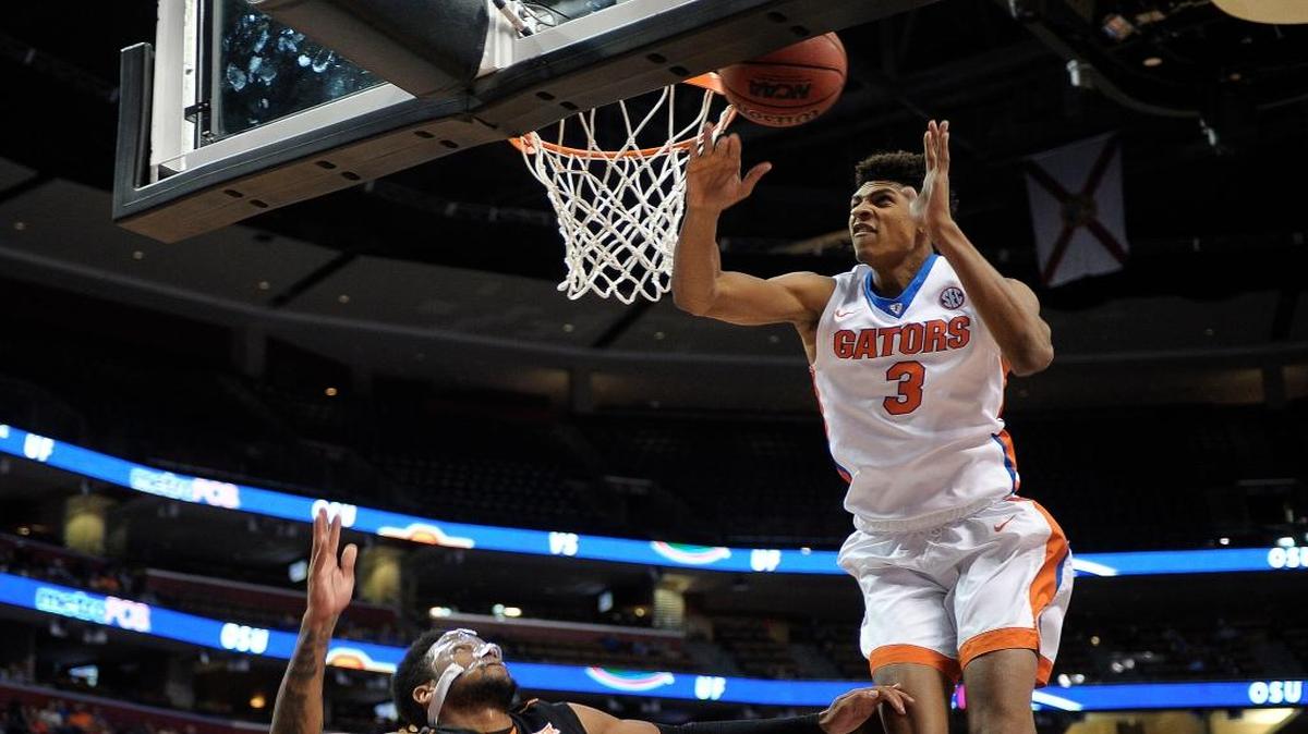 Florida’s Devin Robinson blocks the shot of Oklahoma State’s Jeff Newberry during the first half of the Orange Bowl Basketball Classic, Saturday, December 19, 2015, at BB&T Center.