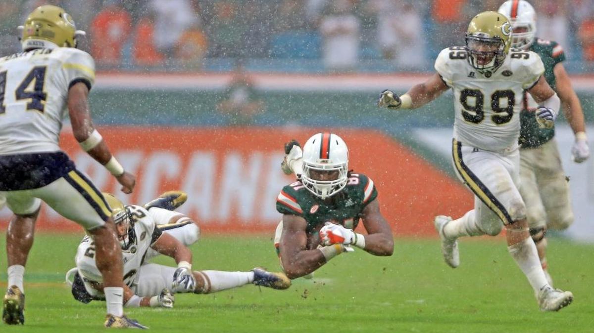 Hurricanes wide receiver Darrell Langham makes a catch in the pouring rain of the University of Miami’s Oct. 14 win against Georgia Tech.