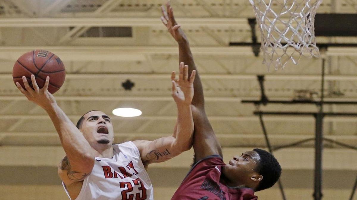 Yunio Barrueta, left, shown in a previous game, had a stellar game but Barry University lost to Lincoln Memorial in the Elite Eight of the NCAA Division II Tournament.