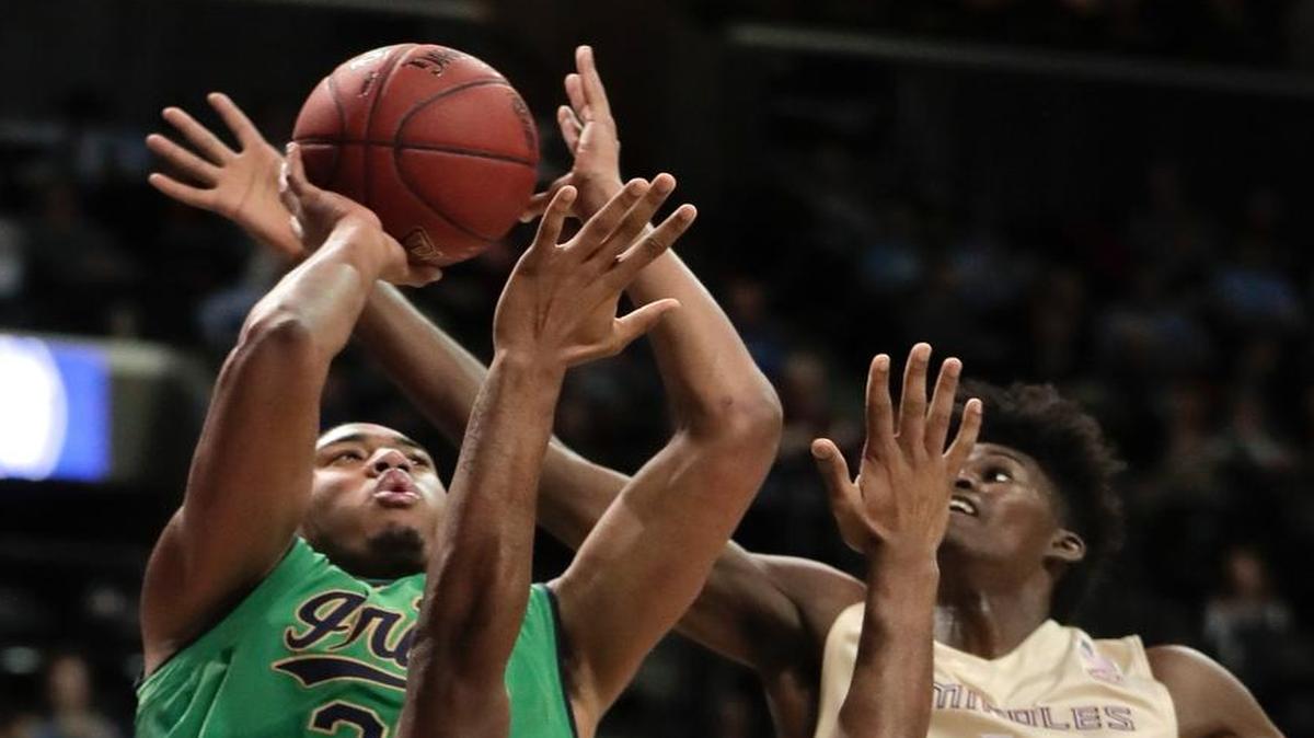 Notre Dame forward Bonzie Colson (35) puts up a shot against Florida State guard Trent Forrest (3) and forward Jonathan Isaac (1) in the first half of an NCAA college basketball game during the semifinals of the Atlantic Coast Conference tournament, Friday, March 10, 2017, in New York.