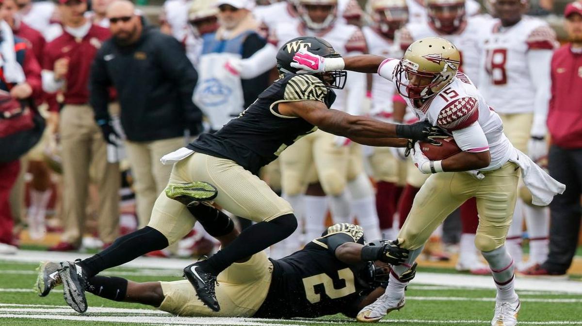 
Florida State wide receiver Travis Rudolph (15) breaks free from Wake Forest defenders Cameron Glenn (2) and Devin Gaudin after a catch in the first half of an NCAA college football game in Winston-Salem, N.C., Saturday, Oct. 3, 2015. 
