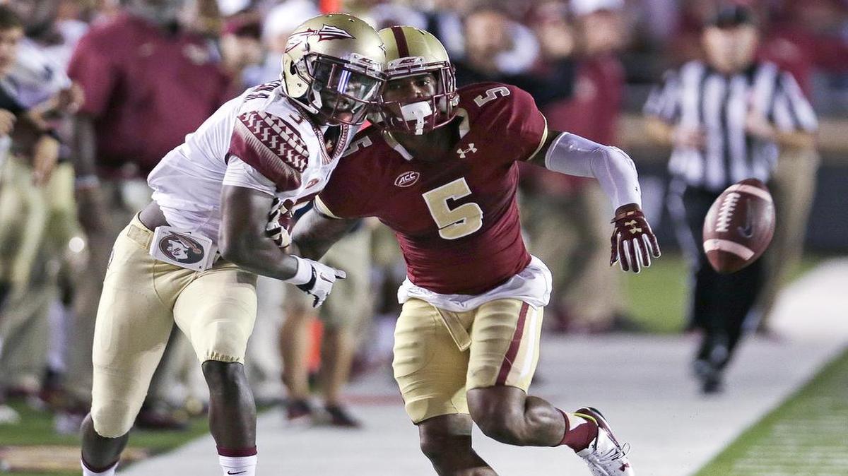 
Boston College defensive back Kamrin Moore (5) breaks up a pass intended for Florida State wide receiver Jesus Wilson during the first half on Friday night.
