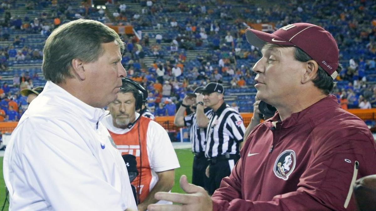 Florida head coach Jim McElwain, left, and Florida State head coach Jimbo Fisher greet each other on the field before an NCAA college football game, Saturday, Nov. 28, 2015, in Gainesville, Fla.