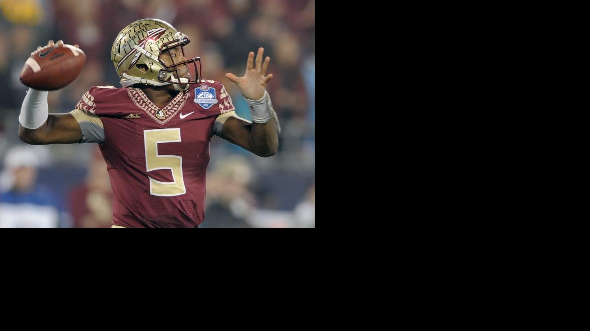 
Florida State quarterback Jameis Winston (5) looks to pass against Georgia Tech during the first half of the Atlantic Coast Conference championship NCAA college football game in Charlotte, N.C., Saturday, Dec. 6, 2014. 
