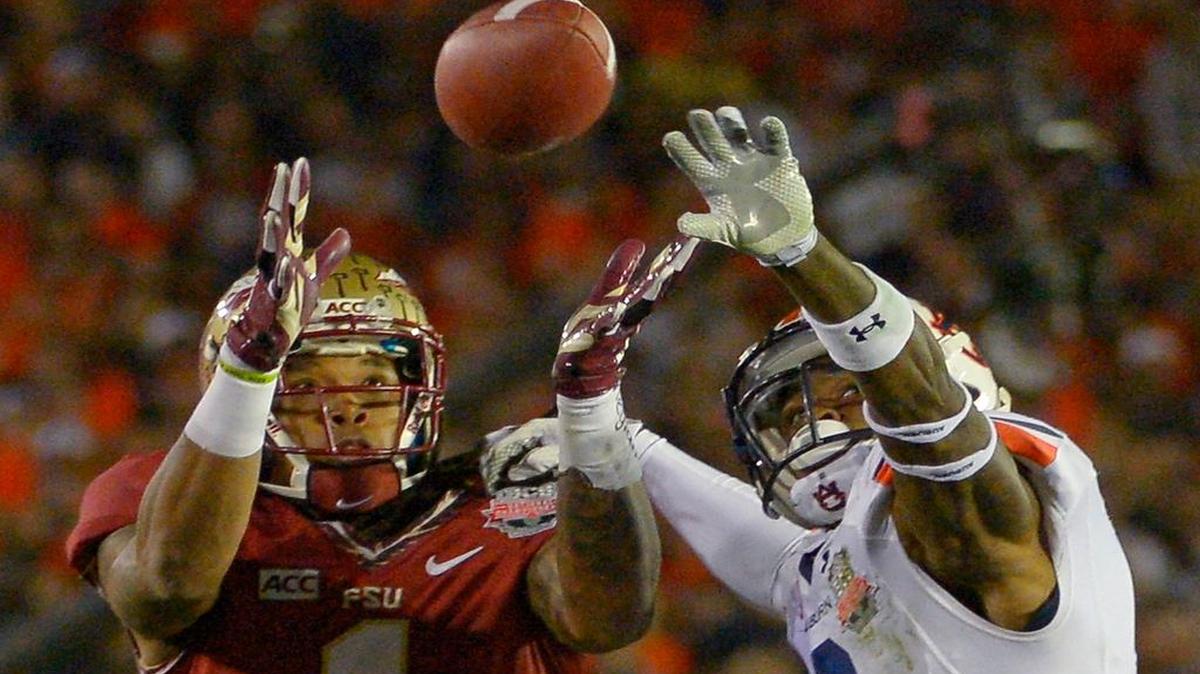 
Giorgio Newberry, a tight end during the 2013 season, tries to catch a pass vs. Auburn. He’s back at his usual position: defensive line. 
