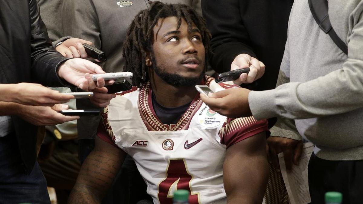 
Florida State running back Dalvin Cook, center, is surrounded by reporters during the team's media day Monday, Dec. 29, 2014, in Los Angeles. 
