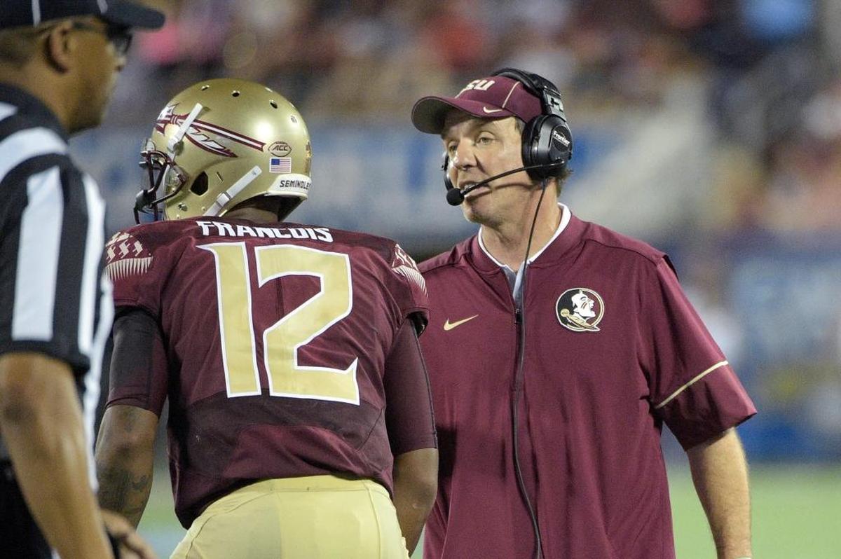 Florida State coach Jimbo Fisher talks with quarterback Deondre Francois during the first half of an last year’s opener against Mississippi on Sept. 5, 2016. Florida State won 45-34.