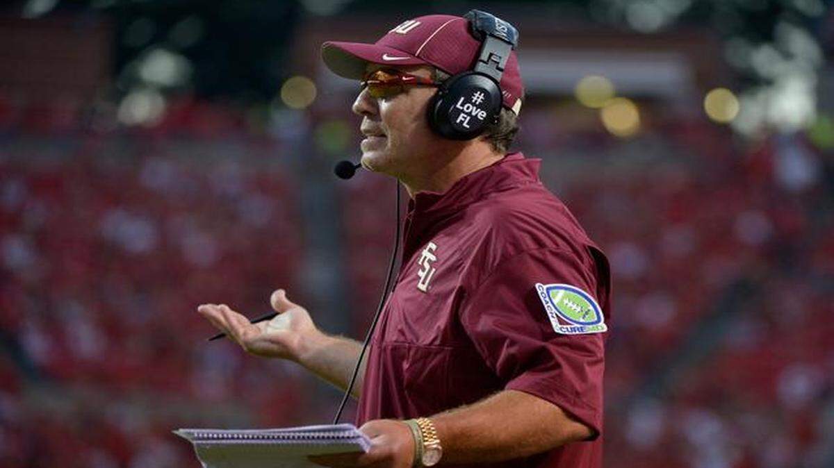 
Head coach Jimbo Fisher of the Florida State Seminoles questions a penalty during their game against the North Carolina State Wolfpack at Carter-Finley Stadium on September 27, 2014 in Raleigh, North Carolina. Florida State won 56-41.
