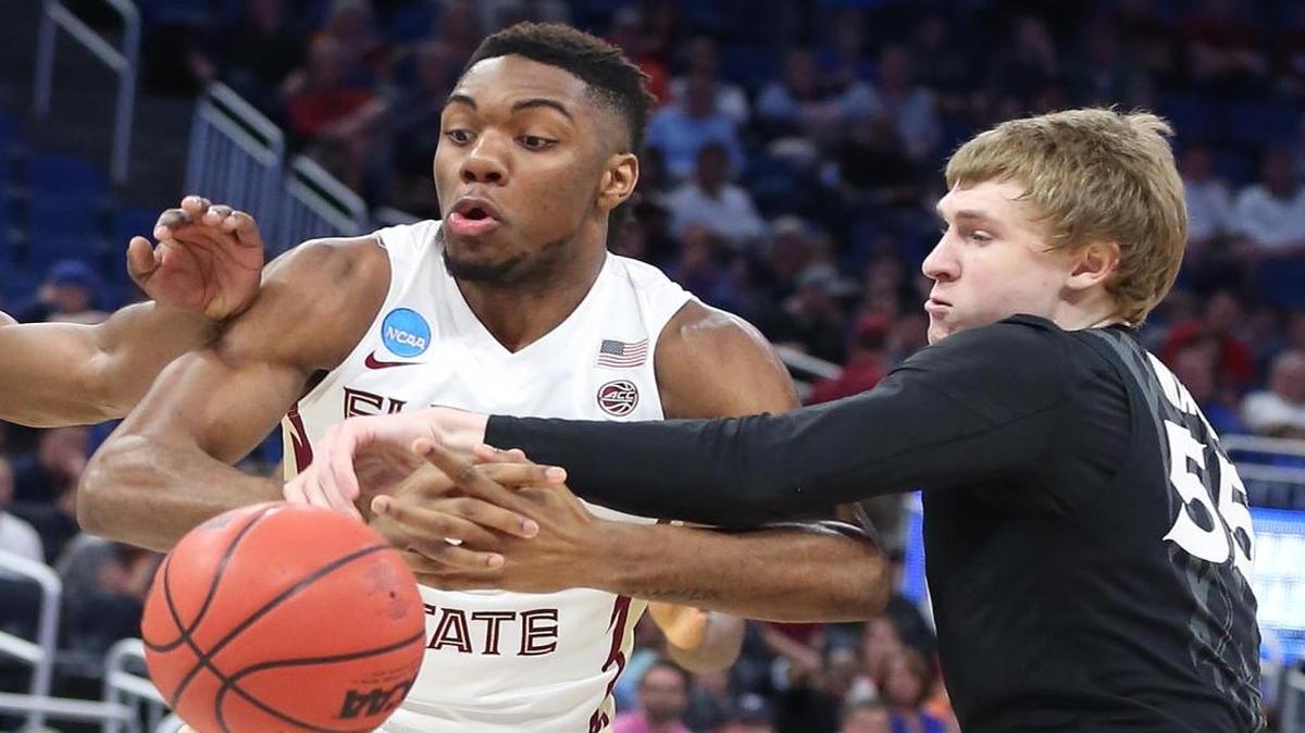 Florida State's Trent Forrest, left, loses the ball to Xavier's J.P. Macura (55) in the second round of the NCAA Tournament at the Amway Center in Orlando, Fla., on Saturday, March 18, 2017.