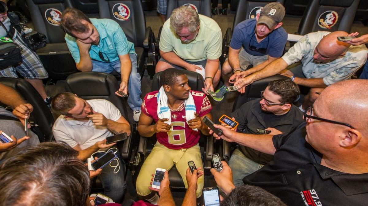 
Florida State quarterback Everett Golson, center, talks during NCAA college football media day in Tallahassee, Fla., Sunday, Aug. 9, 2015. 
