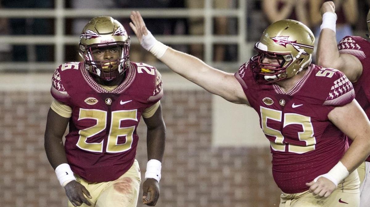 
Florida State offensive lineman Joshua Peters, right, congratulates running back Jonathan Vickers after Vickers scored a touchdown against Texas State in Tallahassee on Saturday, Sept. 5, 2015. 
