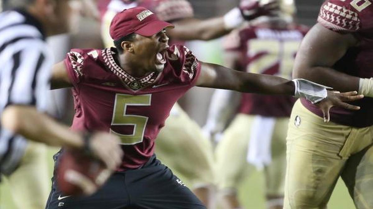 
Suspended Florida State quarterback Jameis Winston screams in celebration after a 23-17 win in overtime against Clemson at Doak Campbell Stadium in Tallahassee, Fla., on Saturday, Sept. 20, 2014.
